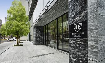 "a modern building with a black and white color scheme , featuring a sign that reads "" the royal park club .""." at The Royal Park Hotel Iconic Osaka Midosuji